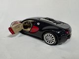 a black car with a red door open on a white surface