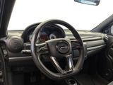 a steering wheel and dashboard of a car in a car showroom