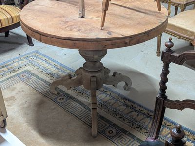 a wooden table with a clock on it in a room
