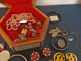a box with a bunch of jewelry inside of it