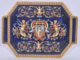 a blue and gold plate with a picture of a woman on it