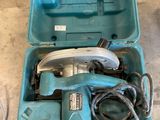a blue box with tools in it sitting on the floor