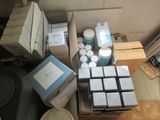 a lot of boxes and containers on the floor