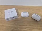 an apple airpods are sitting on a table next to a box
