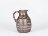 an image of a brown vase sitting on top of a white surface