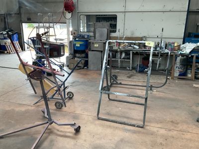 two chairs that are sitting in a garage