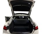 the back of a white car with its trunk open on a white background
