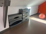 a room with several boxes and a ball in it
