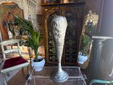 a vase sitting on a glass table in a living room