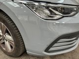 a close up of a car ' s headlight and front bumper