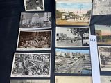 several old black and white photographs of people and buildings on a table