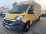 the yellow van is parked in a parking lot with other vehicles