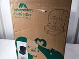the box is open to show the contents of the car seat