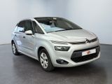 the silver citrole is parked in a room with a black floor
