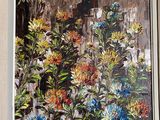a picture of a painting of flowers hanging on a wall