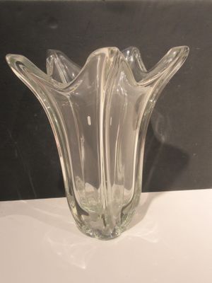 a glass vase that is sitting on a table