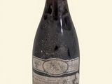 a bottle of wine that is sitting on a table