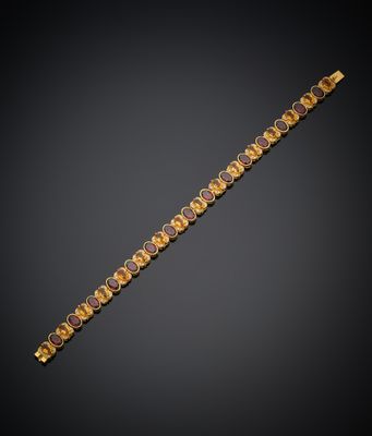 a gold bracelet with amethtites and diamonds