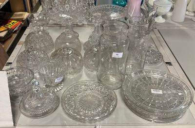a lot of glassware on a table in a store