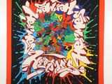 a wall hanging with graffiti on it in a room