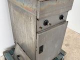 an old fryer sitting on top of a pallet