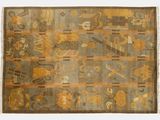 un vieux tapis aux motifs et aux couleurs variés