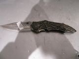 a knife that is laying on a table