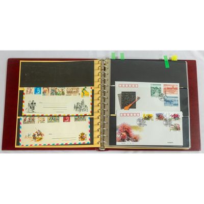 an open book with stamps on it on a table