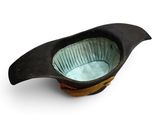 a bird shaped bowl sitting on top of a table