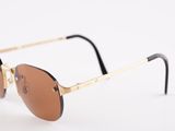 a close up of a pair of sunglasses on a white surface