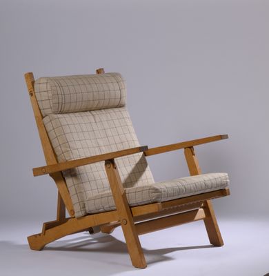 a chair that is sitting on a white surface