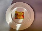 a white plate with a label on it on a table