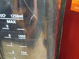 a blender that is sitting next to a box of orange juice