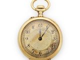 une vieille montre de poche en or avec des chiffres romains et des chiffres romains sur le cadran