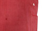 a red cloth with a hole in the middle of it