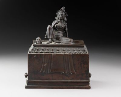 an image of a statue of a woman sitting on top of a wooden box