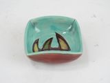 a small bowl with a picture of a boat on it