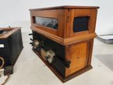 two old fashioned radio ' s on display in a museum
