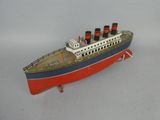 a toy model of a ship on a white surface