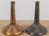two vases that are sitting on a table