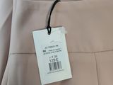 a close up of a dress with a tag on it