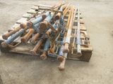 a pile of old rusty pipes sitting on the ground