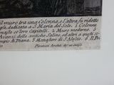 une photo d'une plaque accrochée au mur, sur laquelle figure le portrait d'un homme