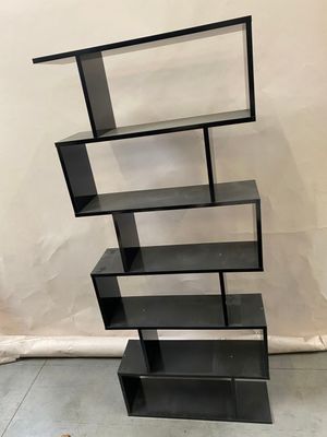 a black bookcase with a glass shelf on top of it