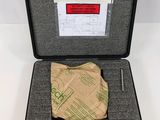 an open briefcase with a piece of paper in it on a white surface