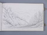 an open book with a drawing of a mountain scene in it