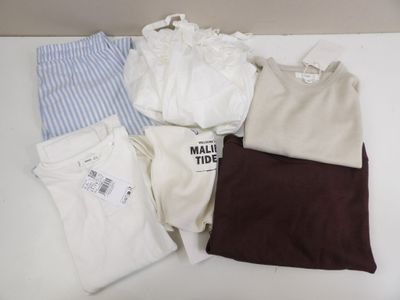 a lot of clothes that are on a table
