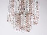 a close up of a glass chandelier hanging from a ceiling