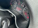 a close up of a car dashboard with various gauges