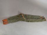 an image of a pair of green canvas belt with a brown leather buckle